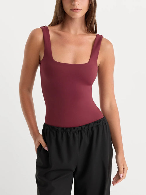 The Sculpting Modern Tank Bodysuit in Berry Noir