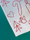 Holiday Embroidered Tea Towel in Burgundy