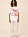 Lainey Wilson Bell Bottom Country Merch Tee in Vintage White